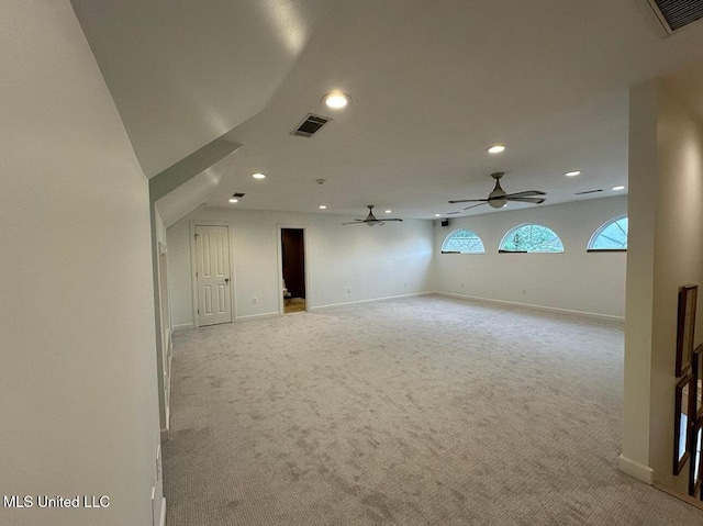 unfurnished room with light carpet, a ceiling fan, visible vents, and recessed lighting