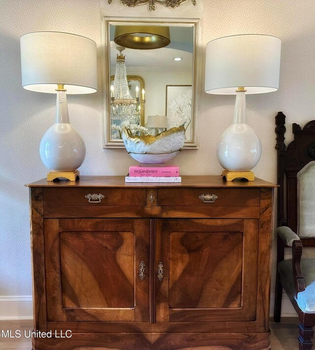interior details with wallpapered walls and baseboards