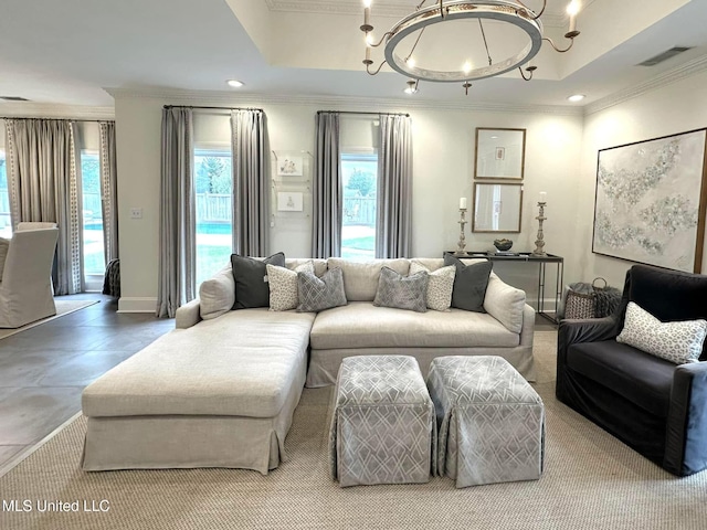 living area with recessed lighting, a notable chandelier, ornamental molding, and a healthy amount of sunlight
