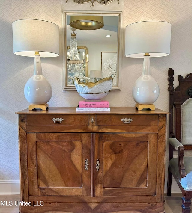 interior details featuring wallpapered walls and baseboards