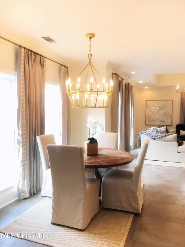 dining space with an inviting chandelier and visible vents