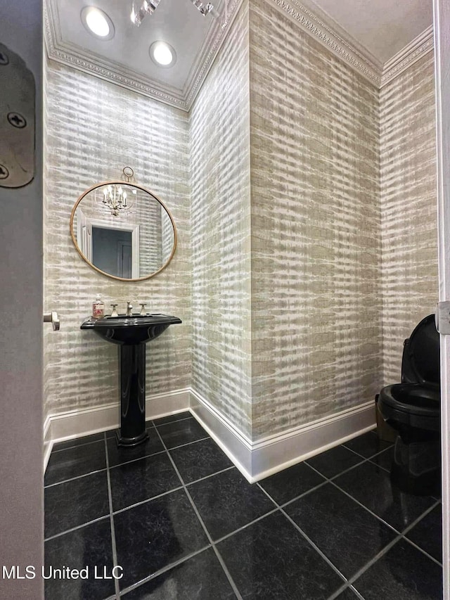 bathroom with baseboards, ornamental molding, tile patterned floors, and wallpapered walls