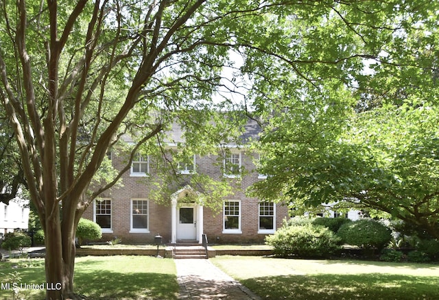 1211 River Rd, Greenwood, MS 38930 - view of front of home with brick siding and a front lawn