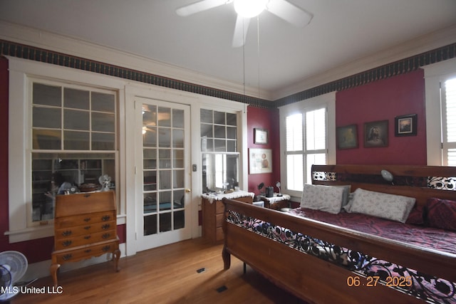 1211 River Rd, Greenwood, MS 38930 - bedroom with light wood-style floors, crown molding, and multiple windows