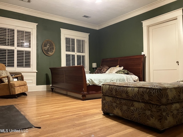 1211 River Rd, Greenwood, MS 38930 - bedroom featuring wood finished floors and crown molding