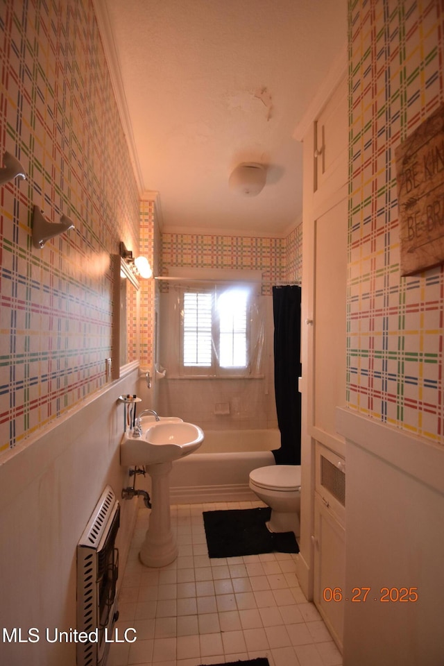 1211 River Rd, Greenwood, MS 38930 - full bath featuring tile patterned flooring, heating unit, shower / tub combo, and wallpapered walls