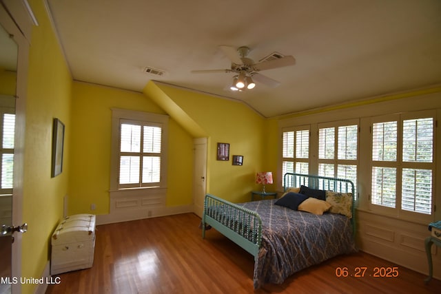 1211 River Rd, Greenwood, MS 38930 - bedroom with vaulted ceiling and wood finished floors