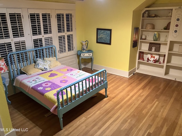 1211 River Rd, Greenwood, MS 38930 - bedroom with baseboards and wood finished floors