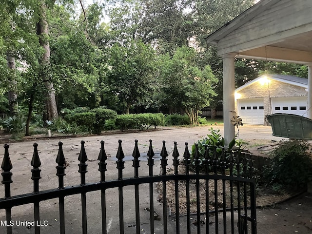 1211 River Rd, Greenwood, MS 38930 - view of yard with an outdoor structure, a garage, and driveway