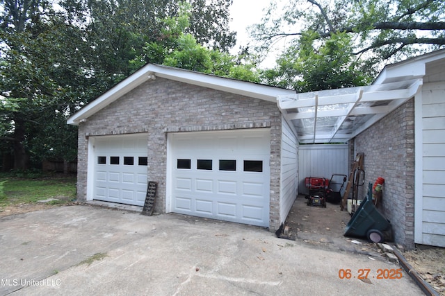1211 River Rd, Greenwood, MS 38930 - view of home's exterior featuring brick siding and a detached garage