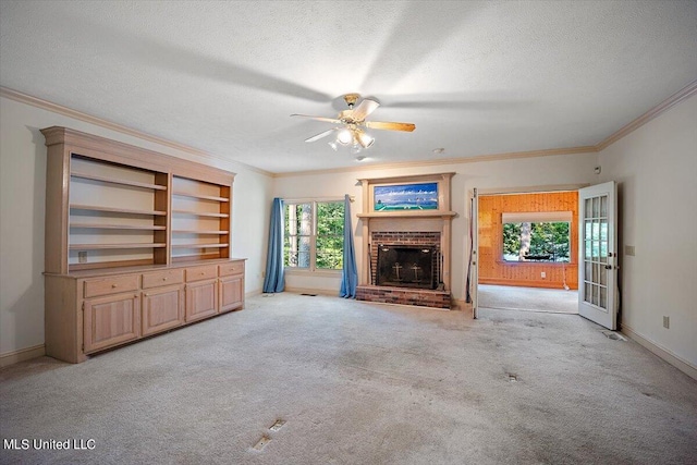 unfurnished living room featuring a textured ceiling, light colored carpet, and plenty of natural light