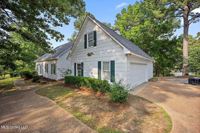 view of property exterior with a garage