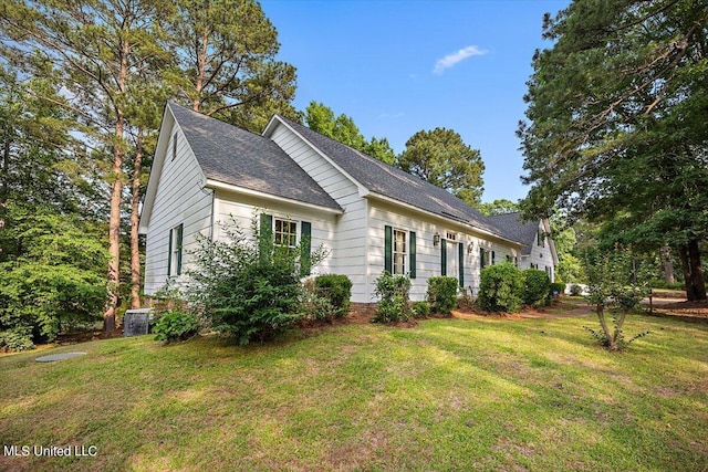 view of home's exterior with central AC and a lawn