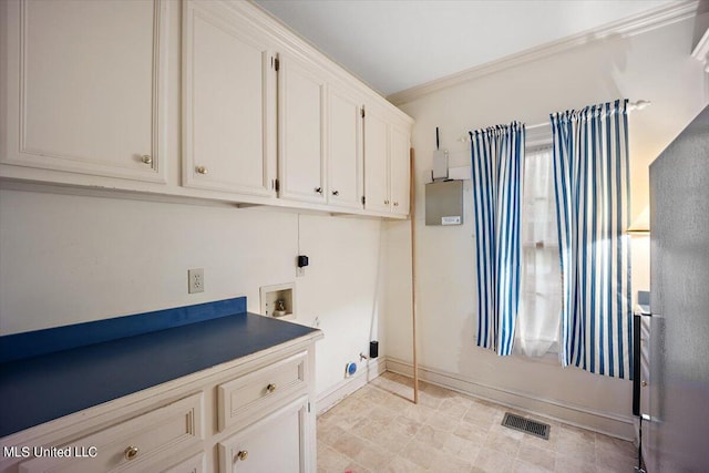 washroom featuring hookup for a washing machine and ornamental molding