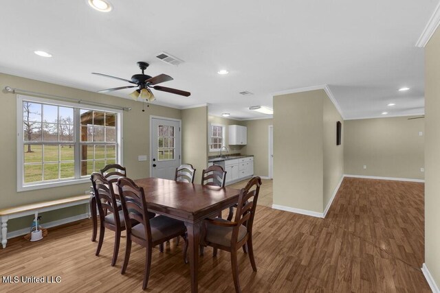 1144 Little Big Mound Rd, Bentonia, MS 39040 - dining room with light wood finished floors, baseboards, ceiling fan, and visible vents