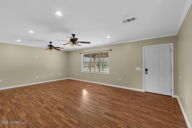 1144 Little Big Mound Rd, Bentonia, MS 39040 - unfurnished living room with baseboards, visible vents, crown molding, and wood finished floors