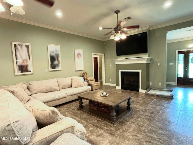 706 Anchor Lake Rd, Carriere, MS 39426 - living room featuring a ceiling fan, ornamental molding, a fireplace, recessed lighting, and tile patterned floors