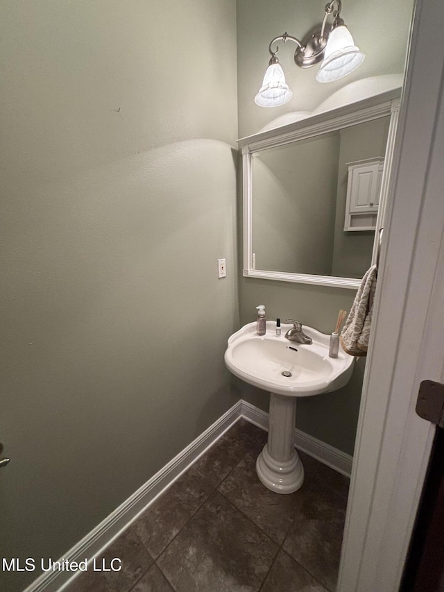 706 Anchor Lake Rd, Carriere, MS 39426 - bathroom featuring a sink and tile patterned floors
