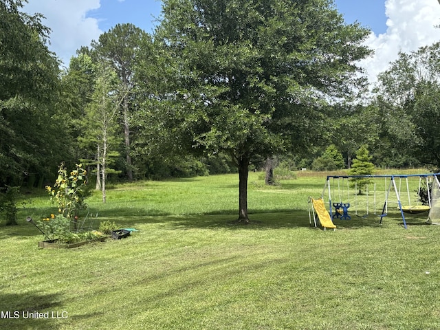 706 Anchor Lake Rd, Carriere, MS 39426 - view of green lawn with a playground