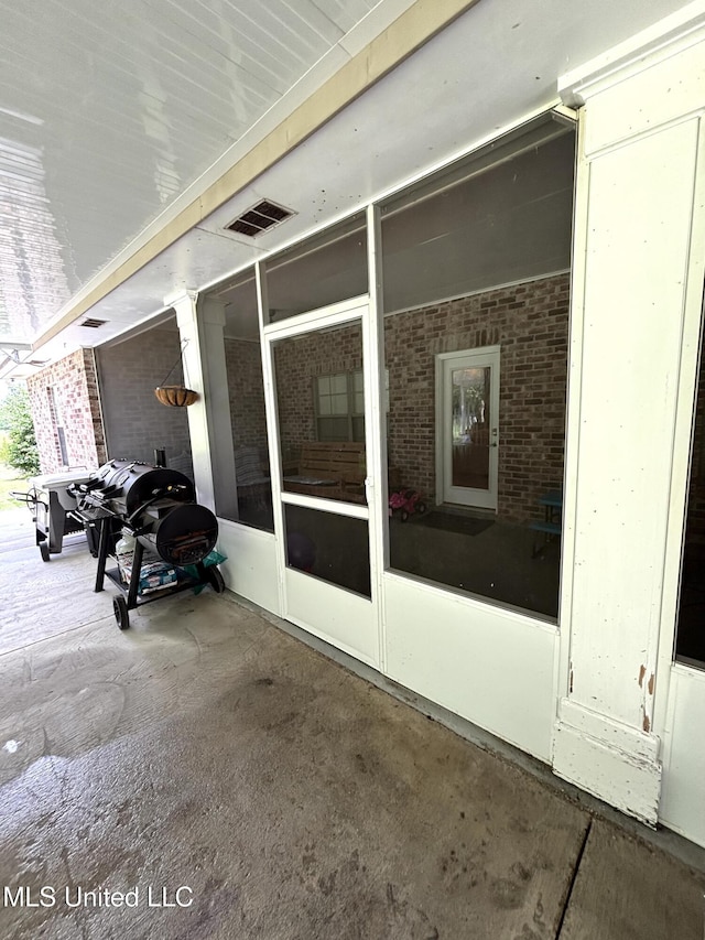 706 Anchor Lake Rd, Carriere, MS 39426 - view of patio / terrace featuring a sunroom