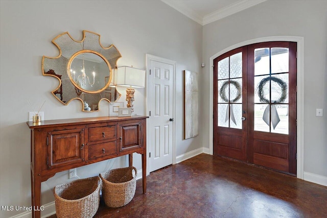 foyer featuring baseboards, arched walkways, ornamental molding, french doors, and concrete floors