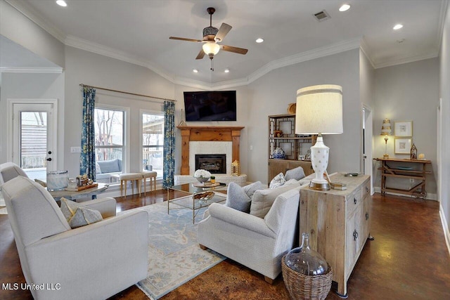 living room featuring recessed lighting, visible vents, and a glass covered fireplace