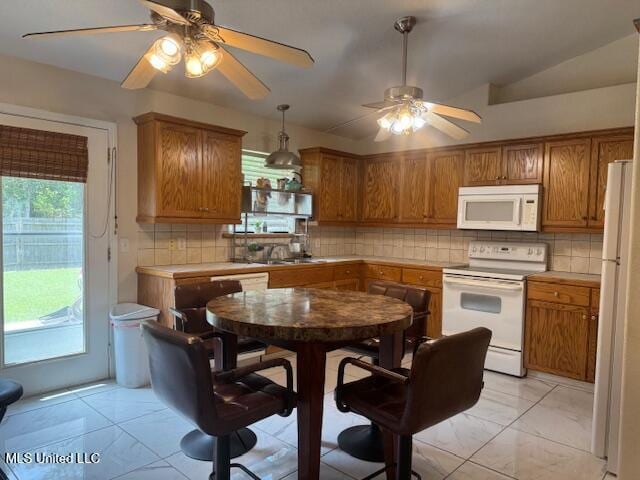 kitchen with marble finish floor, backsplash, white appliances, brown cabinetry, and ceiling fan