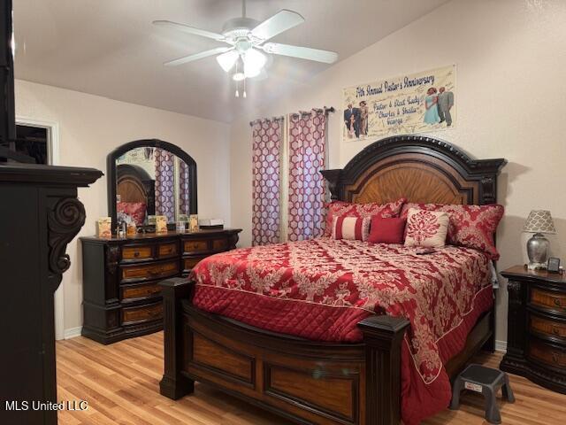 bedroom with ceiling fan and wood finished floors