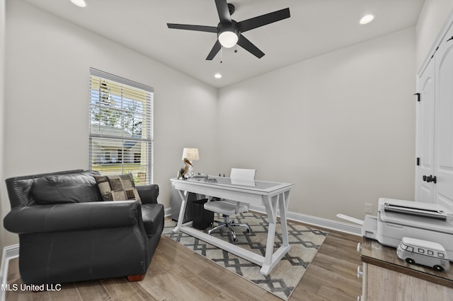 office space with a ceiling fan, recessed lighting, baseboards, and wood finished floors