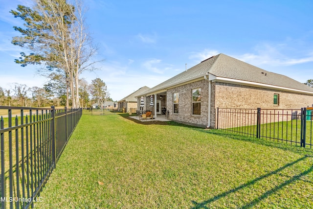 view of yard with a fenced backyard and a patio