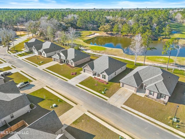 bird's eye view with a forest view, a water view, and a residential view