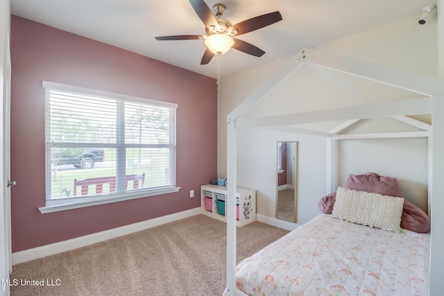15581 Ollie Ln, Biloxi, MS 39532 - bedroom featuring carpet, multiple windows, a ceiling fan, baseboards, and lofted ceiling