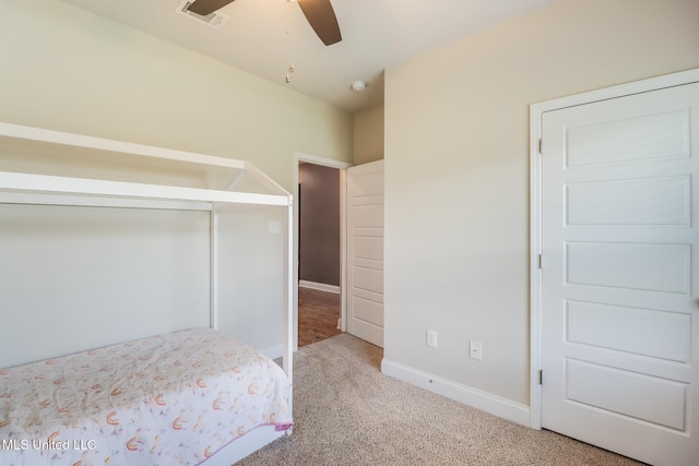 15581 Ollie Ln, Biloxi, MS 39532 - unfurnished bedroom featuring carpet floors, baseboards, a ceiling fan, and a closet