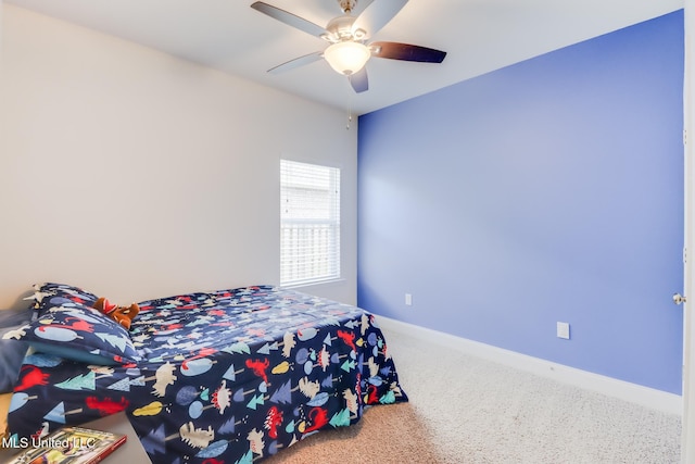 15581 Ollie Ln, Biloxi, MS 39532 - bedroom featuring carpet flooring, baseboards, and a ceiling fan