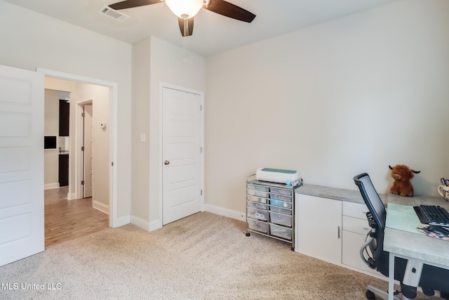 15581 Ollie Ln, Biloxi, MS 39532 - office area featuring ceiling fan, light colored carpet, and baseboards