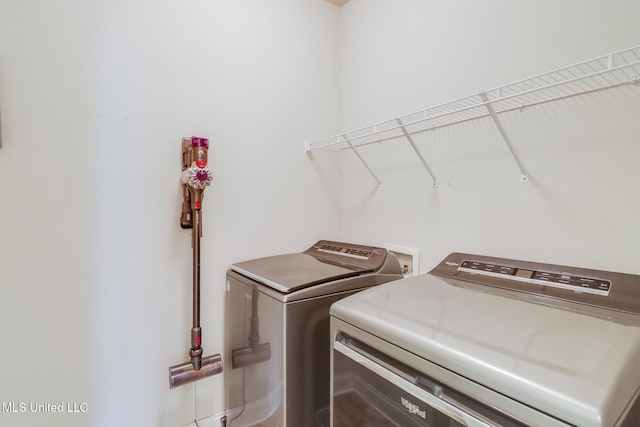 15581 Ollie Ln, Biloxi, MS 39532 - laundry room featuring separate washer and dryer