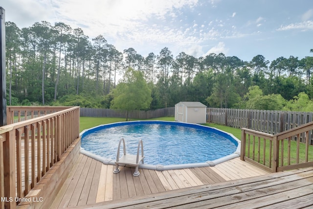 15581 Ollie Ln, Biloxi, MS 39532 - view of pool with a wooden deck and view of scattered trees