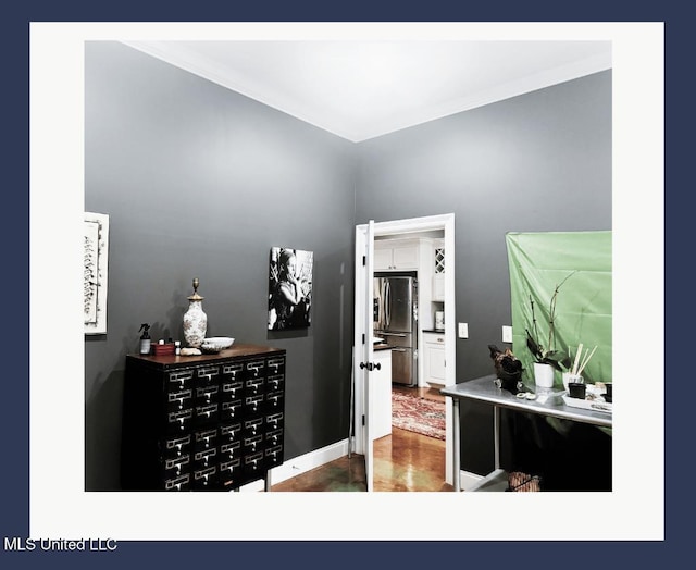 interior space featuring crown molding and wood-type flooring