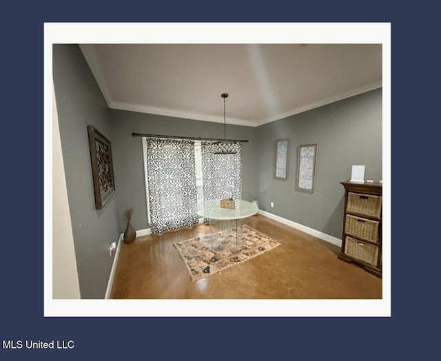 unfurnished dining area with ornamental molding and concrete floors