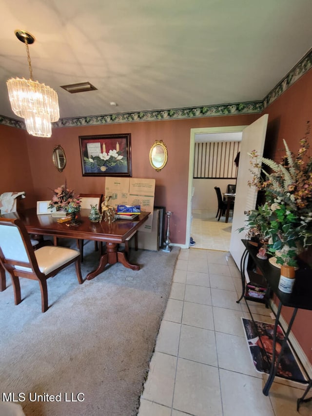 dining area featuring light tile patterned flooring and a chandelier