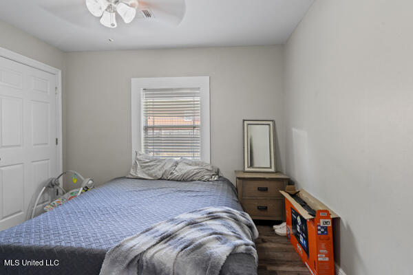 284 Osborn Moody Rd, Poplarville, MS 39470 - bedroom featuring dark wood-style flooring and ceiling fan