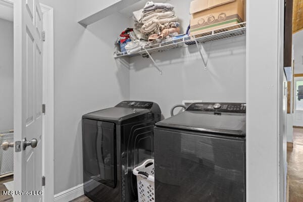 284 Osborn Moody Rd, Poplarville, MS 39470 - laundry room with separate washer and dryer and baseboards