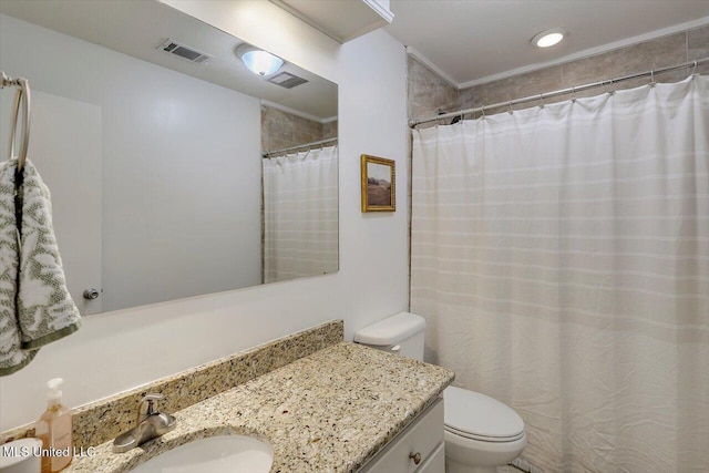 bathroom featuring toilet, visible vents, a shower with shower curtain, and vanity