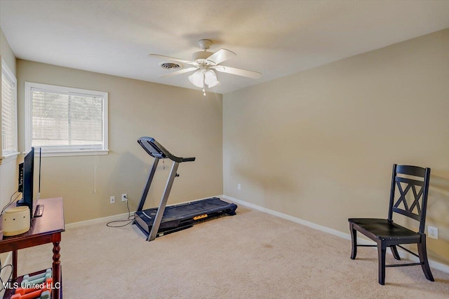 workout area featuring carpet floors, a ceiling fan, visible vents, and baseboards