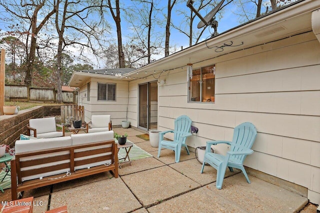 view of patio / terrace with outdoor lounge area and fence