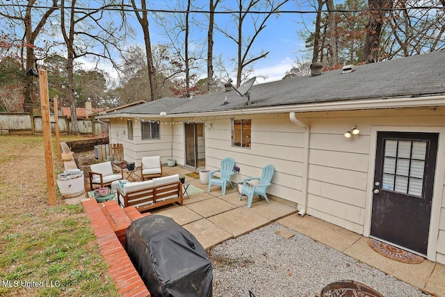 rear view of property with an outdoor hangout area, a patio, a shingled roof, and fence