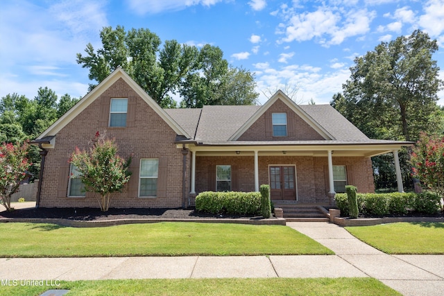 view of front of house featuring a front lawn and a porch