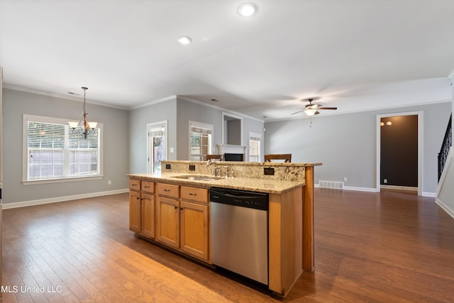 kitchen featuring hardwood / wood-style floors, a wealth of natural light, sink, and dishwasher