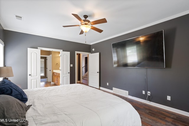 bedroom featuring ceiling fan, dark hardwood / wood-style floors, and crown molding