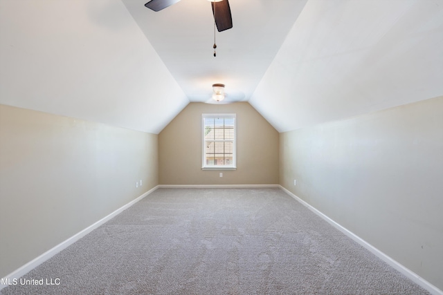 bonus room featuring ceiling fan, light colored carpet, and vaulted ceiling